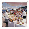 Fine weather allows passengers to enjoy a casual buffet on deck - no need to dress for dinner on this occasion! by Union Castle Line Collection