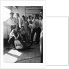 A group of off-duty crew from 'Carinthia' (1925) pose with a captured shark on deck by Marine Photo Service