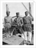 Three Lascars of the 'Viceroy of India' (1929), standing behind the wheel of one of the ship's tenders by Marine Photo Service