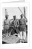 Three Lascars of the 'Viceroy of India' (1929), standing behind the wheel of one of the ship's tenders by Marine Photo Service