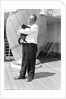 Steward with ship's cat by Marine Photo Service