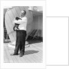 Steward with ship's cat by Marine Photo Service