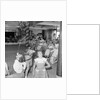 Three children in the "Apple Eating" contest, possibly in the ballroom of the 'Chusan' (1950) by Marine Photo Service