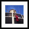 Father Christmas, or Santa Claus, climbing the grill in front of the forward funnel above the bridge on 'Oriana' (1960) by Marine Photo Service
