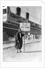 A Tunisian tour guide posing with his official P & O sign, Bizerte, Tunisia by Marine Photo Service