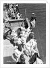 A sailor takes a sounding as the ship approaches the Greek island of Santorini by Marine Photo Service