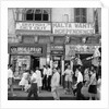 A view of shops with anti-British and pro-Independence signs, possibly on Kings Street, Valetta, Malta. by Marine Photo Service