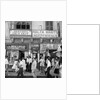 A view of shops with anti-British and pro-Independence signs, possibly on Kings Street, Valetta, Malta. by Marine Photo Service