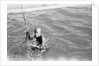 A Kuwaiti pearl diver draws breath between dives by Alan Villiers