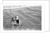 A Kuwaiti pearl diver draws breath between dives by Alan Villiers
