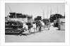 Water donkeys carry full goatskins into town by Alan Villiers