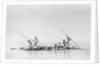 Imported ship-building timbers were poled from dhow to boatyard by Alan Villiers