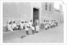 Sailors relaxing outside a merchant's house by Alan Villiers