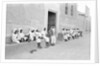 Sailors relaxing outside a merchant's house by Alan Villiers
