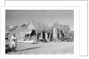 Jizan market with 'ushshah' houses by Alan Villiers