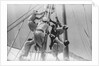 Sailors climbing the halyard blocks by Alan Villiers
