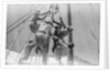 Sailors climbing the halyard blocks by Alan Villiers