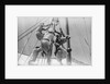 Sailors climbing the halyard blocks by Alan Villiers