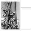 Sailors climbing the halyard blocks by Alan Villiers