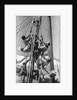 Sailors climbing the halyard blocks by Alan Villiers
