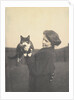 An informal photograph of Kathleen Alice Taylor holding Slabbie the black/white cat in her hands by Unknown