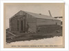 Davies, the carpenter, working on the hut by Herbert George Ponting