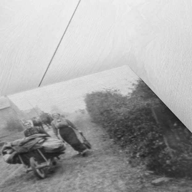 A British soldier helping a woman return to her village, France by Anonymous