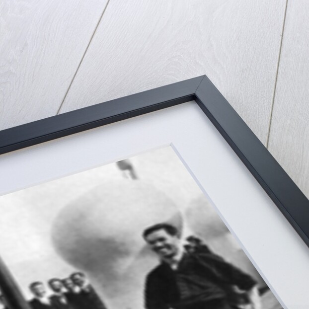 The Prince of Wales testing a Japanese fencing helmet, Japan by Anonymous