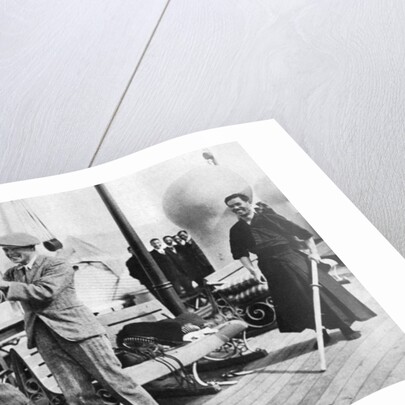The Prince of Wales testing a Japanese fencing helmet, Japan by Anonymous