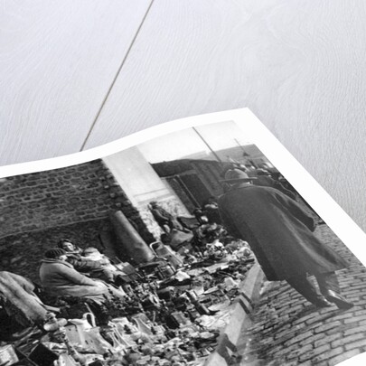 A display of goods at the flea market, Paris by Ernest Flammarion