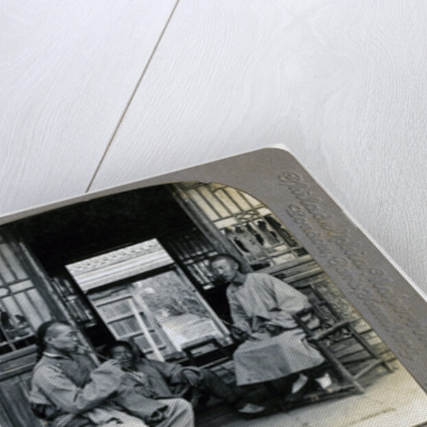 A social hour, a typical Chinaman smoking, China by CH Graves