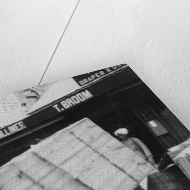 A porter lifting a large load, Chakrata, India by Anonymous