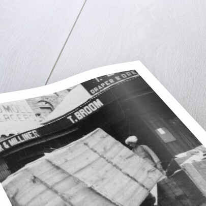 A porter lifting a large load, Chakrata, India by Anonymous