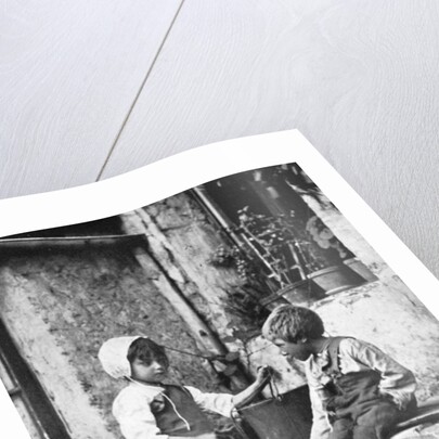 Two children in a backyard by Constance Ellis