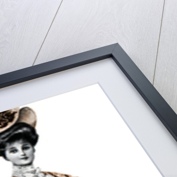 Woman wearing a long dress and a hat by Andre & Sleigh
