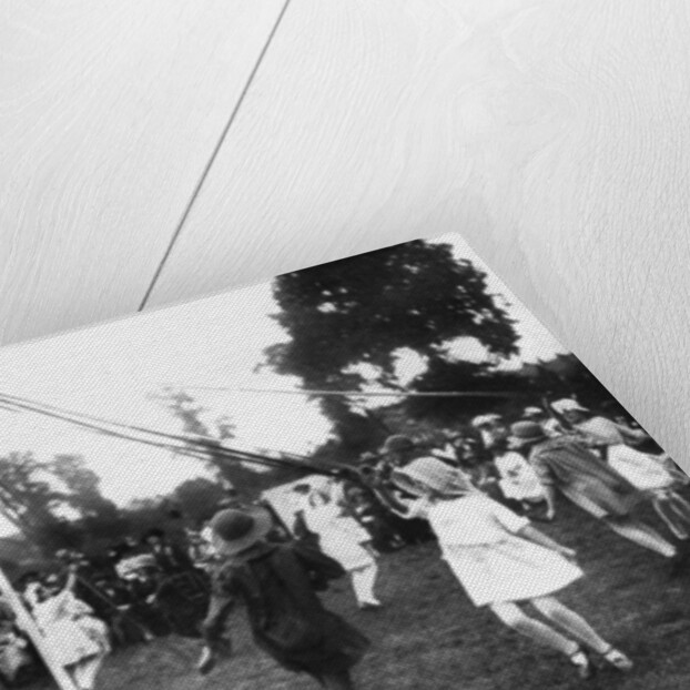 Children dancing round a maypole by Anonymous