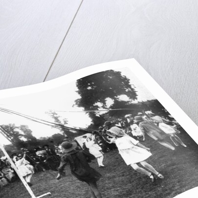 Children dancing round a maypole by Anonymous