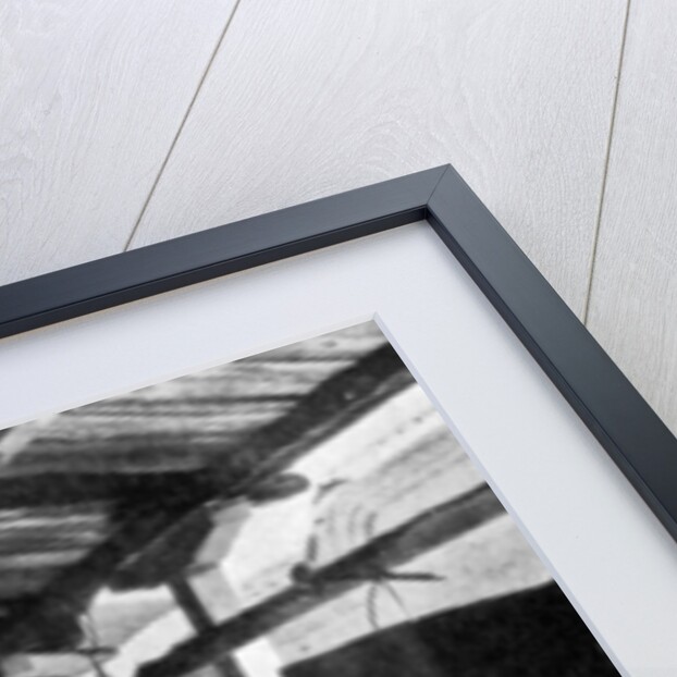 Monk sounding the call to prayer on a gong, Greece by Nomias