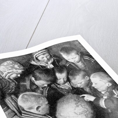 Lapp children looking at a globe by Anonymous