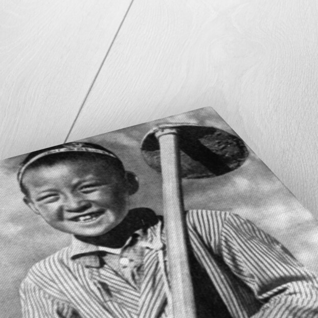 Uzbek schoolboy working on a farm by Anonymous
