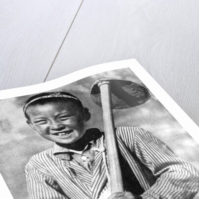Uzbek schoolboy working on a farm by Anonymous