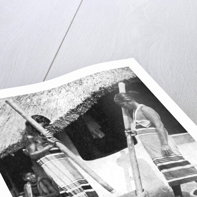 Newar women pounding grain, Nepal by Ewing Galloway