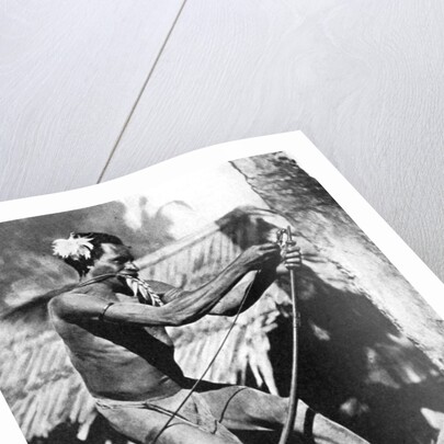 A huntsman stringing his bow by Wide World Photos