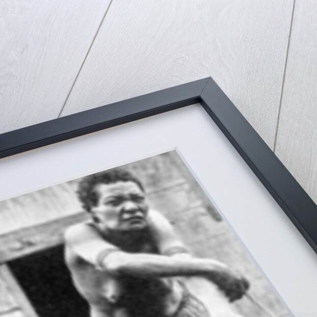 A mother and her child, Papua, New Guinea by Ewing Galloway