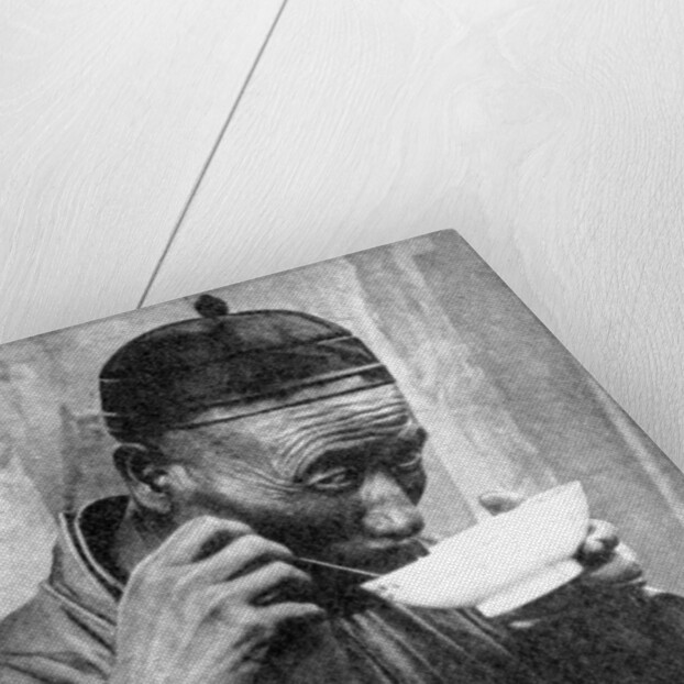 A man eating, Mukden (Shenyang), China by Wide World Photos