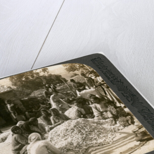 Women sorting large piles of silk cocoons, Antioch, Syria by Underwood & Underwood