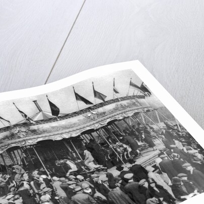 A merry-go-round, part of a bank holiday carnival on Hamstead Heath, London by Anonymous