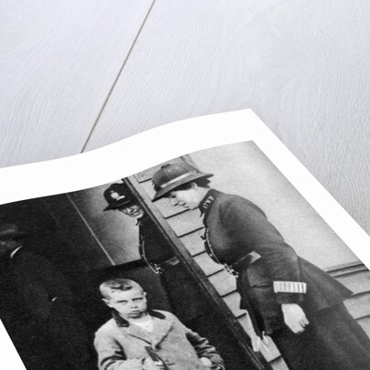 An East End child and a policewoman, London by Anonymous