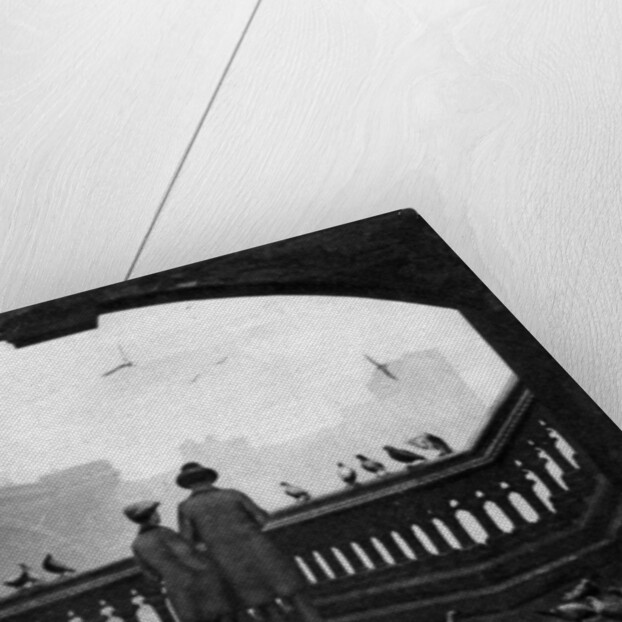 A man and a boy feeding the birds by Blackfriars Bridge, London by Anonymous