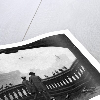A man and a boy feeding the birds by Blackfriars Bridge, London by Anonymous